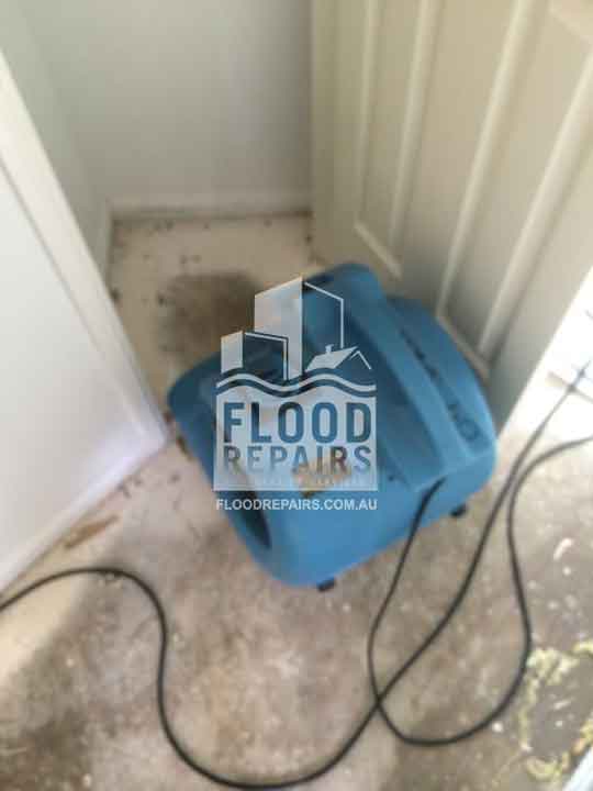 Lovett-Bay dirty damaged floor before flood job equipment 