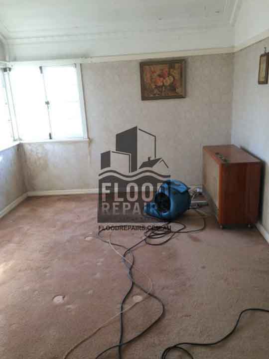damaged room before Flood Restoration & Repairs repairing and cleaning