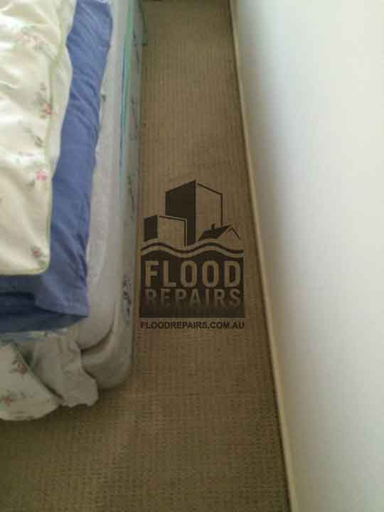 wet bedroom carpet before drying and cleaning
